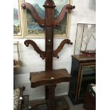 A late Victorian mahogany hall stand with raised t