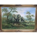 A gilt framed oil on canvas study of elephants by