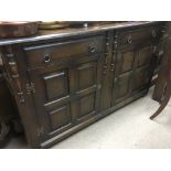 A collection of oak furniture comprising a sideboard, table and 5 chairs plus a small table (8).