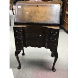 A Queen Ann style walnut bureau with a fall front