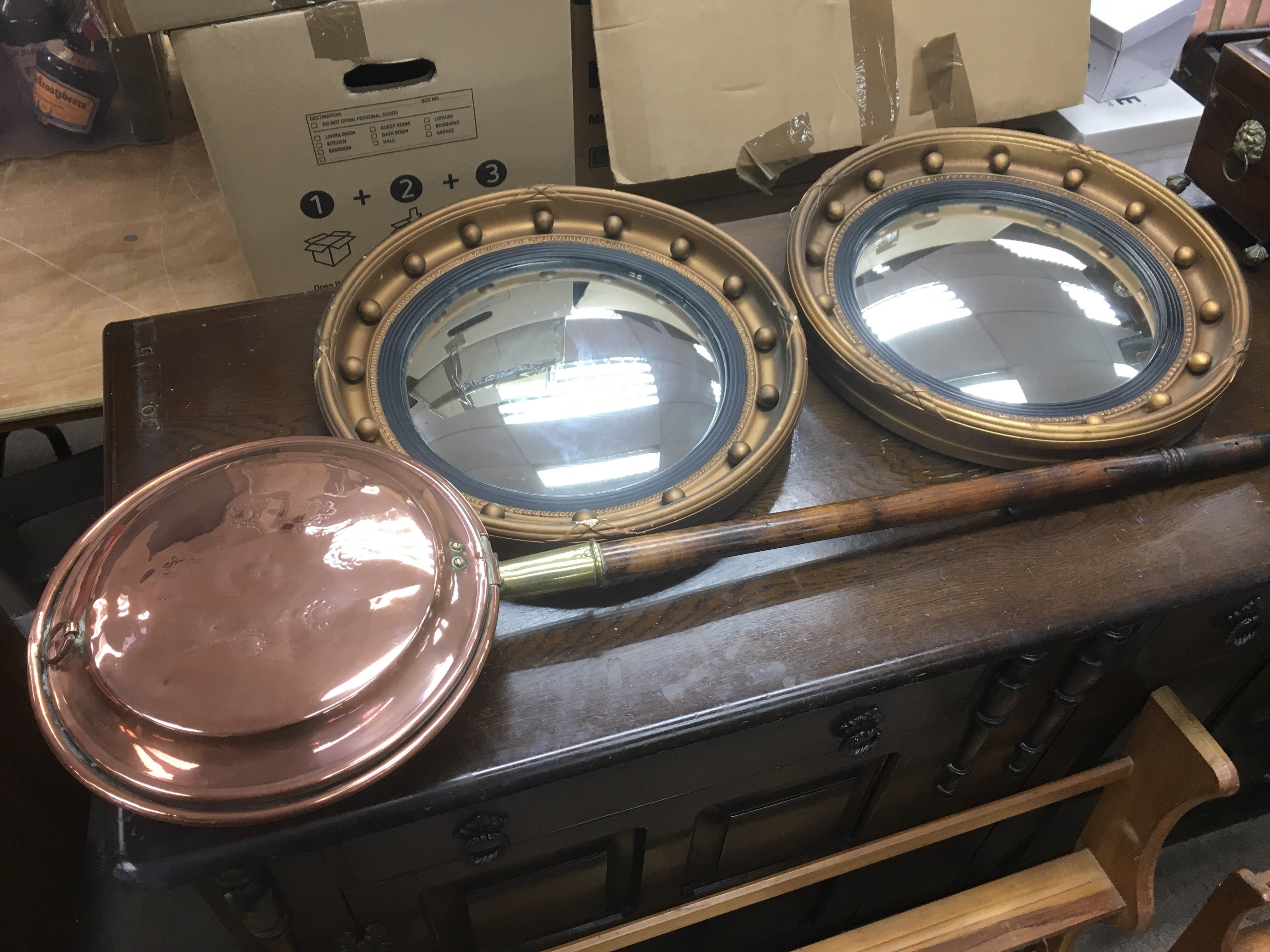 A copper warming pan and a pair of plaster gilded