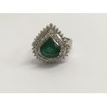 A 18 ct gold emerald and diamond white gold ring size O