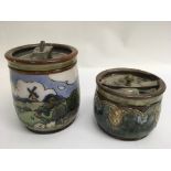 Two Royal Doulton tobacco jars, one decorated with rural landscape scene