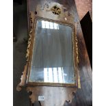 A George III walnut and parcel gilt wall mirror.