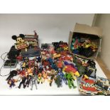 A collection of figures including Terminator , karate kid, Mr T, Hulk hogan, and Optimus prime etc