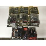 8 Horror related carded figures including Tortured souls, Real monsters, Halloween, Texas chainsaw