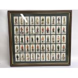 A framed and glazed displayed of cigarette cards of the British Empire overseas.