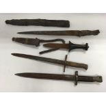 A collection of bayonets and knives including a British bayonet stamped ER '92