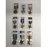 A collection of 9 loose medals including First World War examples