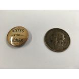 An unusual old penny stamped on the kings head with "votes for women" and a votes for women pin