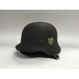 A WW2 double decal M35 pattern German steel helmet.