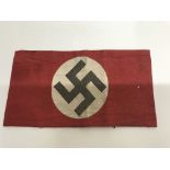 A WW2 German NSDAP arm band on light printed cloth. Good condition.
