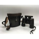 A pair of third Reich 10x50 binoculars in a leather case stamped Hamburg 1937, inscribed within