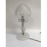 A cut glass table lamp with detachable shade