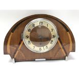 An Art Deco walnut clock.