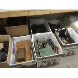 A large collection of woodworking tools including various steel wood planes.