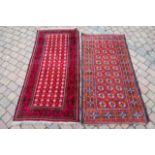 Two Afghan rugs with tomato field and geometric de