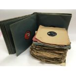 A box of 78 rpm records and an HMV album of Gilber