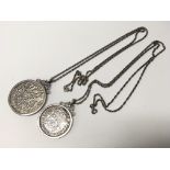 A pair of silver coin pendants. Weight approx 56.4