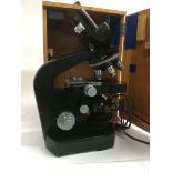 A wild heerbrugg microscope in a fitted case