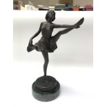 An Art Deco style bronzed figure of a dancer on a