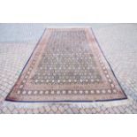 A large Persian style carpet, with repeat geometri