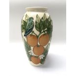 A Moorcroft pottery vase depicting finches with an