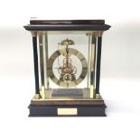 A cased, skeleton mantel clock with Roman numerals