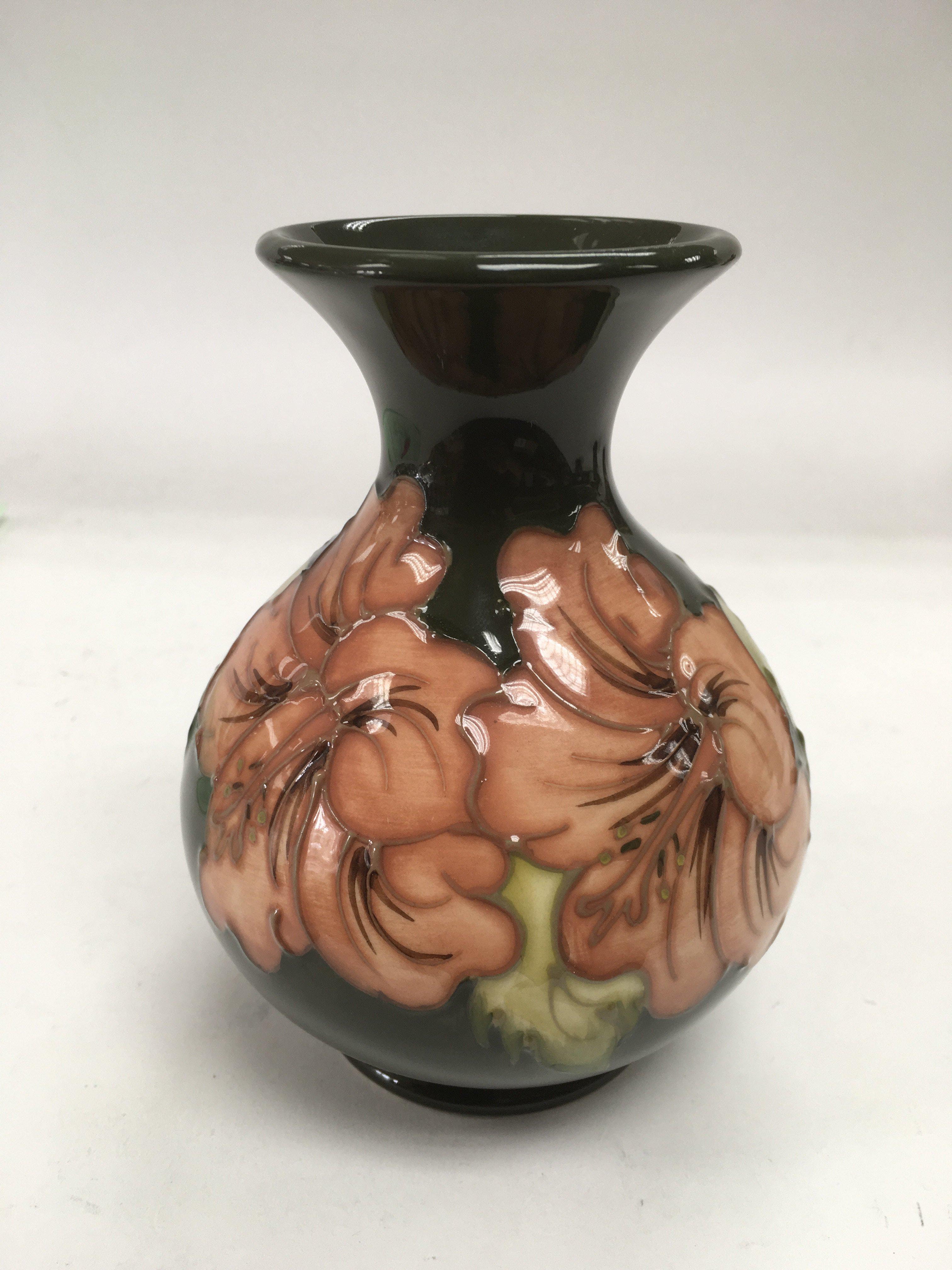 A Moorcroft vase with a flared rim above a baluste