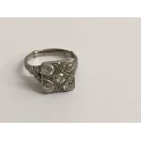 An Art Deco platinum ring inset with five diamonds