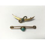 A pair of 9ct gold brooches with turquoise stones