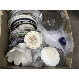 A box of mixed plates and a decanter