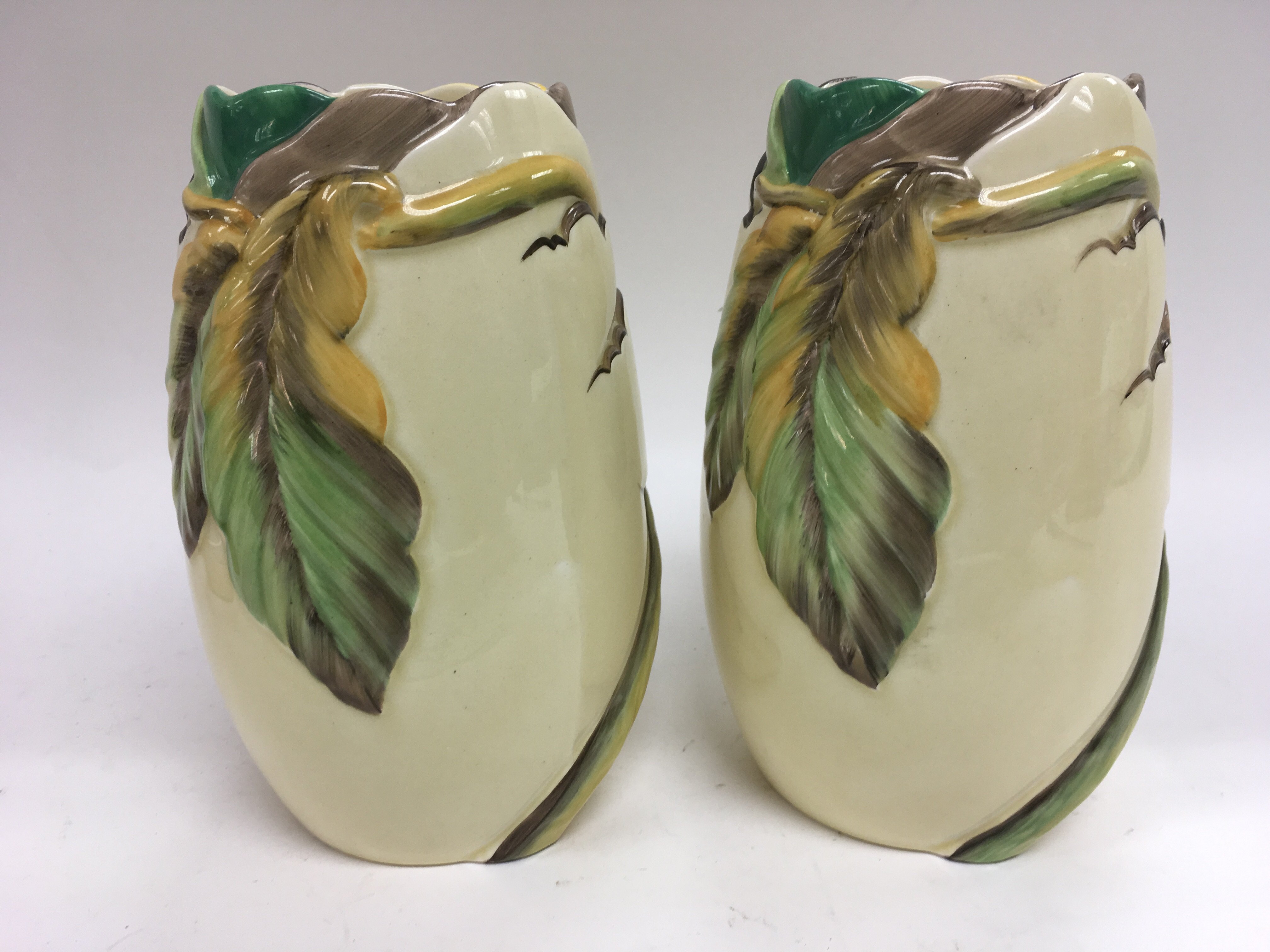 A pair of Clarice Cliff vases with naturalistic de