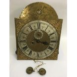 A Georgian engraved brass clock face movement with