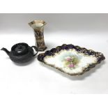A black basalt tea pot, vase and Doulton dish.