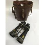 A pair of leather cased military binoculars made b