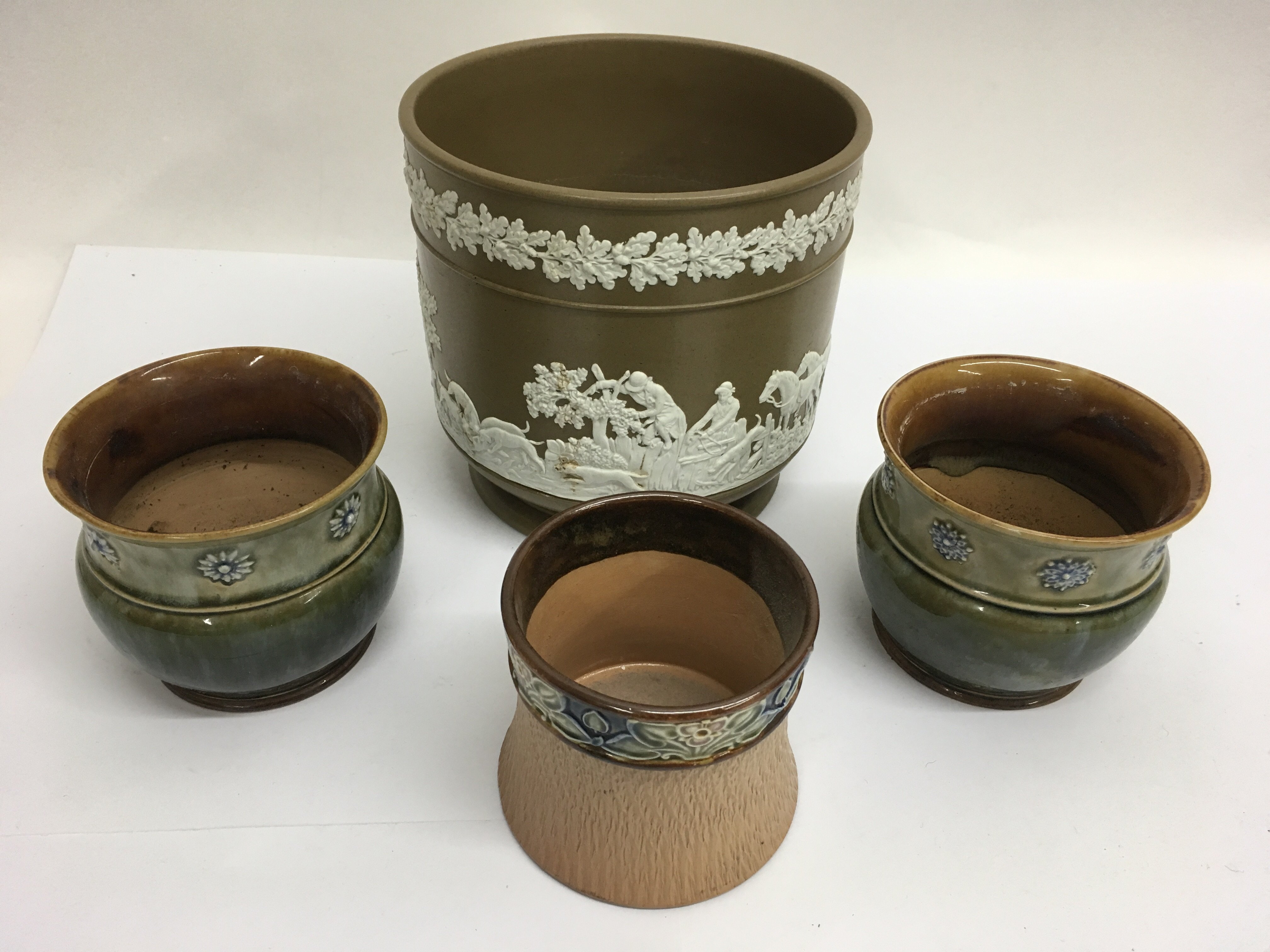 A Wedgwood style jardiniere and three Doulton plan
