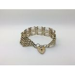 A boxed ladies 9ct gate bracelet weighing approxim