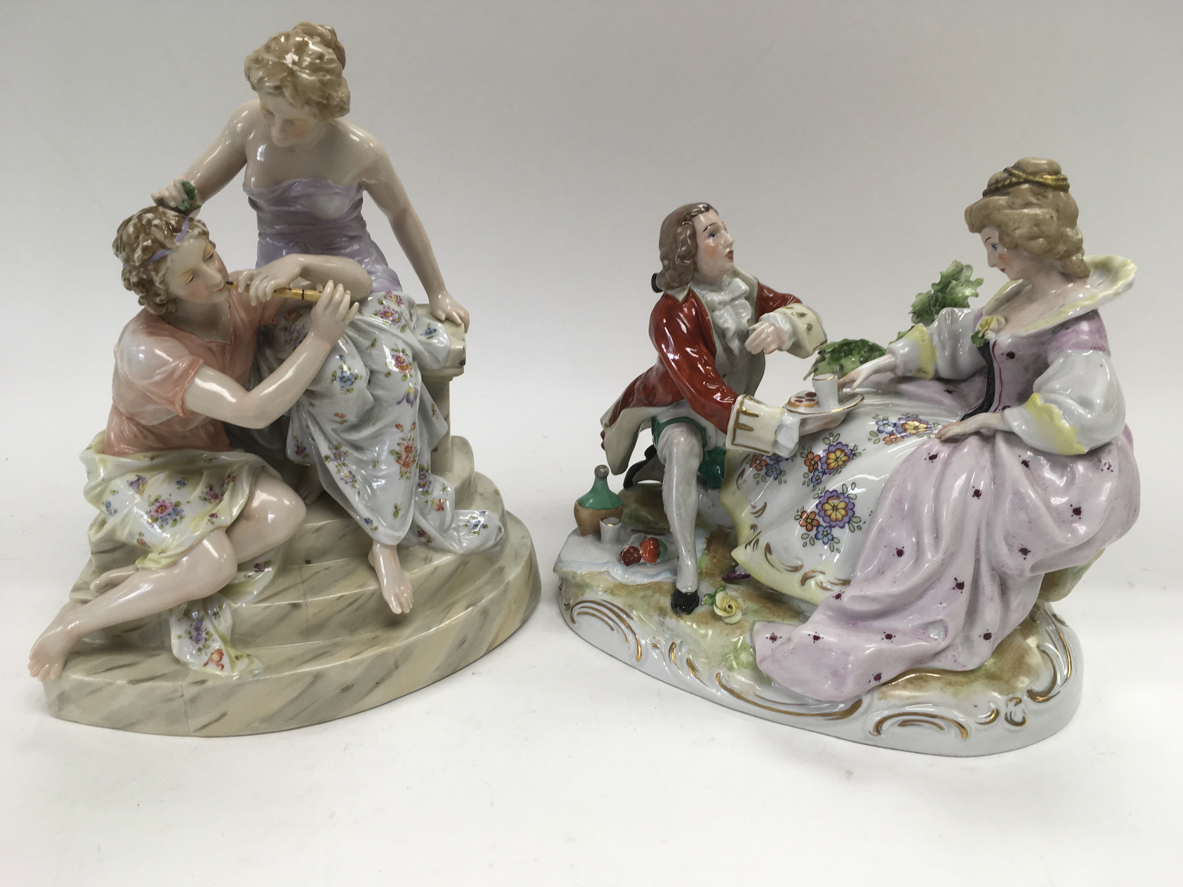 Two continental porcelain figural groups, one of a