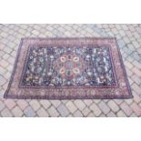 A Persian part silk style rug, the blue ground dec