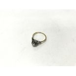 An 18ct gold and platinum diamond ring. Size appro