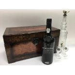 A 1984 port with decanter and two glasses presente