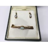 A 9ct gold opal brooch and earrings. Weight approx