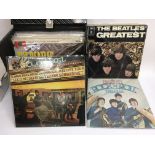 A record box containing a collection of Beatles LP