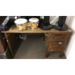 A wooden office desk with one flight of drawers.Ap