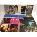 A collection of LPs by various artists including P