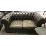 A two seater Chesterfield brown leather sofa and m