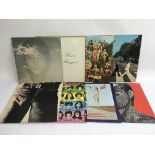 A collection of Beatles and Rolling Stones LPs including 'Abbey Road', 'Sticky Fingers' with