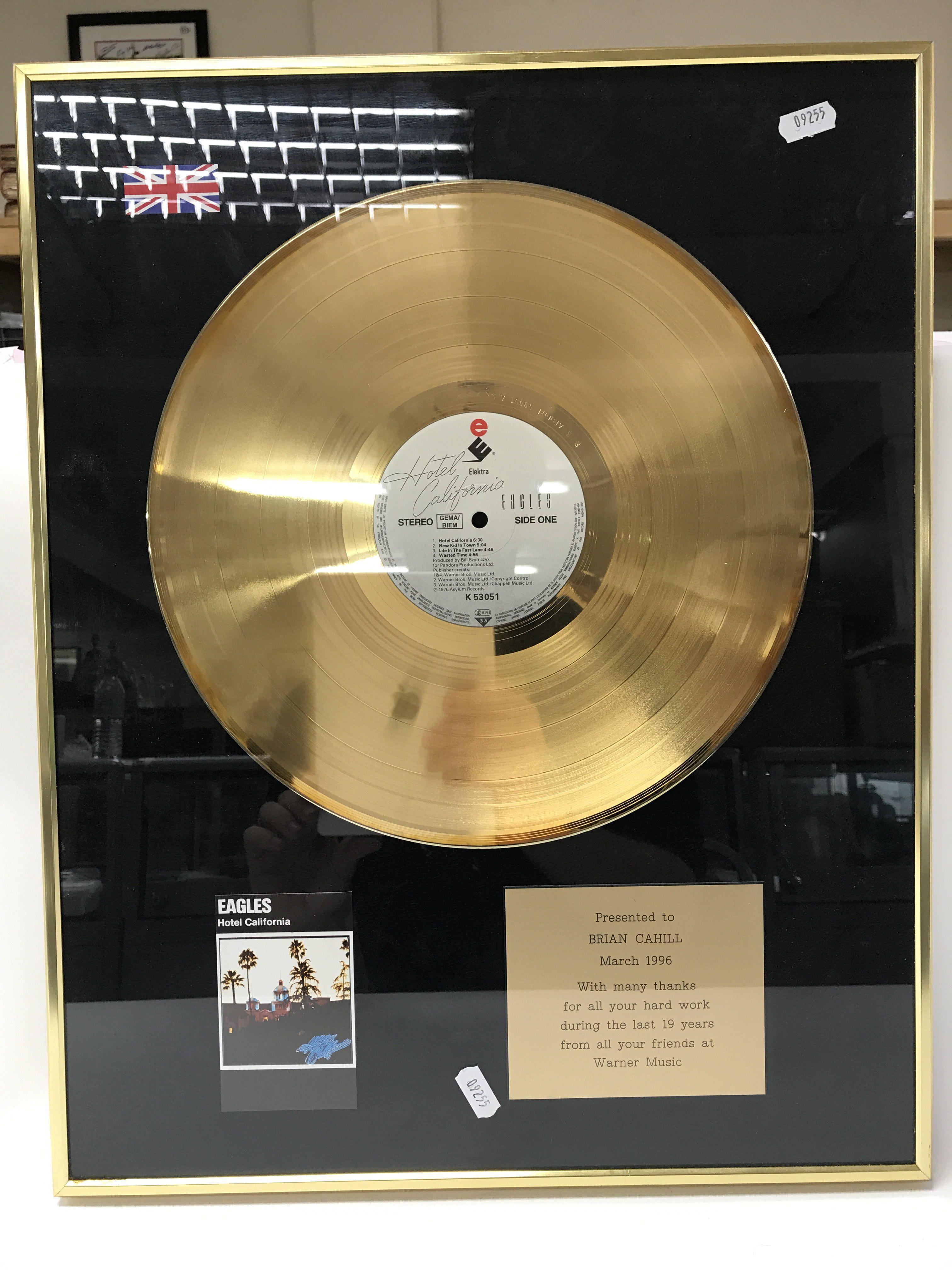 A framed and glazed gold disc for the classic albu