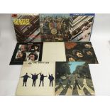 Eight LPs by The Beatles comprising early issues o